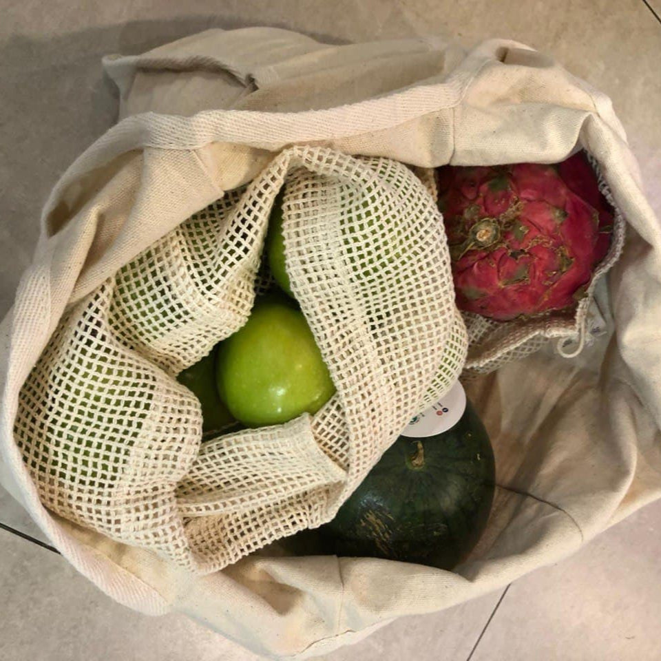 porple & pure organic cotton foldable tote bag containinng fruits