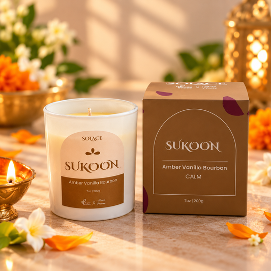 SUKOON Amber Vanilla Bourbon soy candle in a Diwali-inspired still life, Solace Collection by Purple & Pure