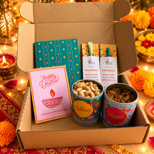 Mithaas Diwali gift box with cashews and raisins in seed paper sleeves, plantable notebook, pen, pencil and Happy Diwali card